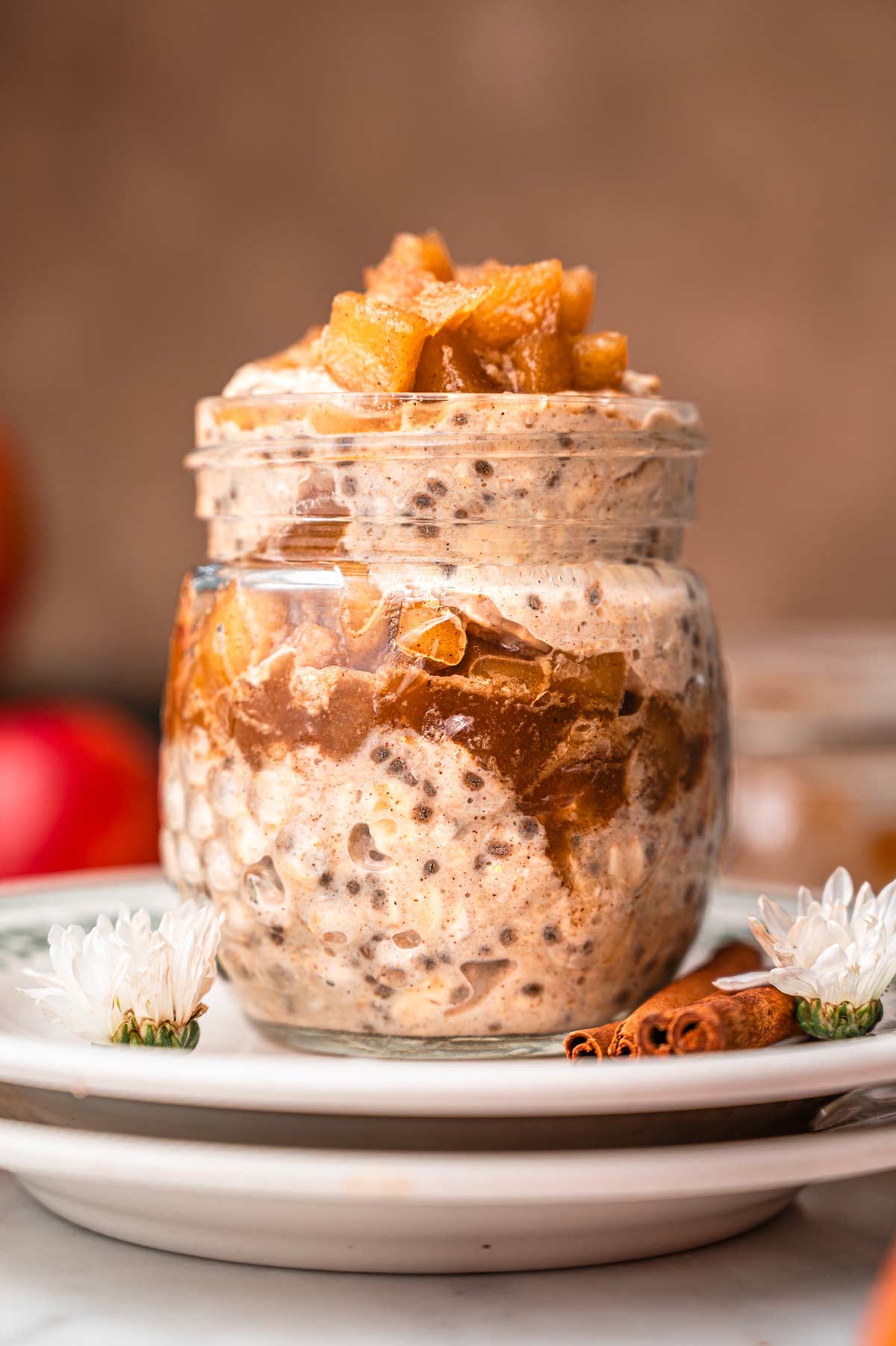 apple cinnamon oats layered in a glass jar