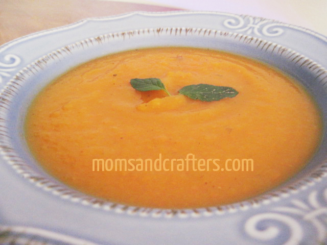 creamy butternut squash soup with a drizzle of cream