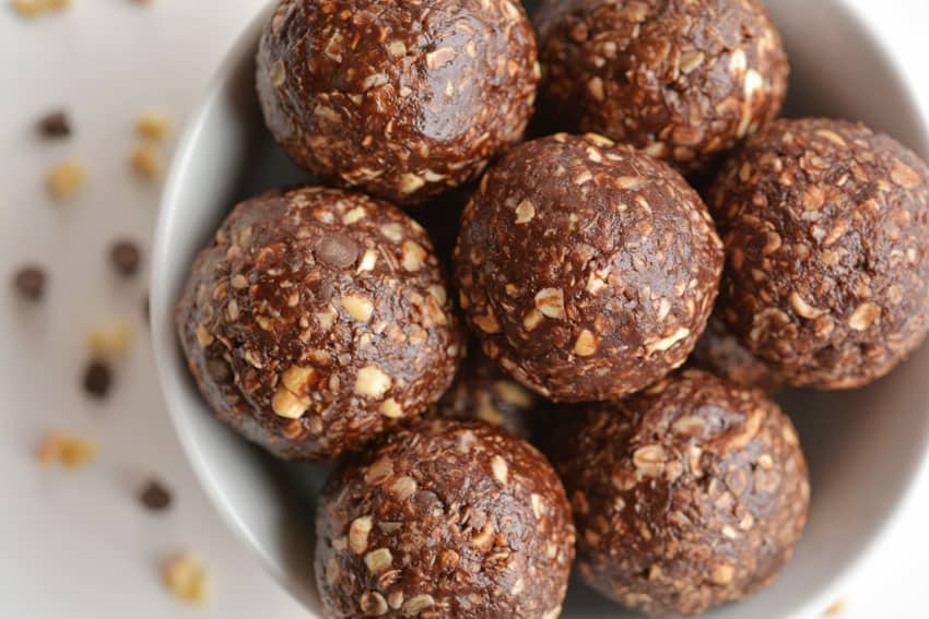 peanut butter energy bites stacked on a plate