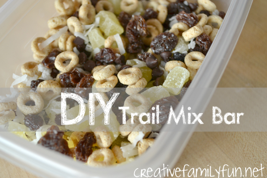 paper cups filled with trail mix ingredients