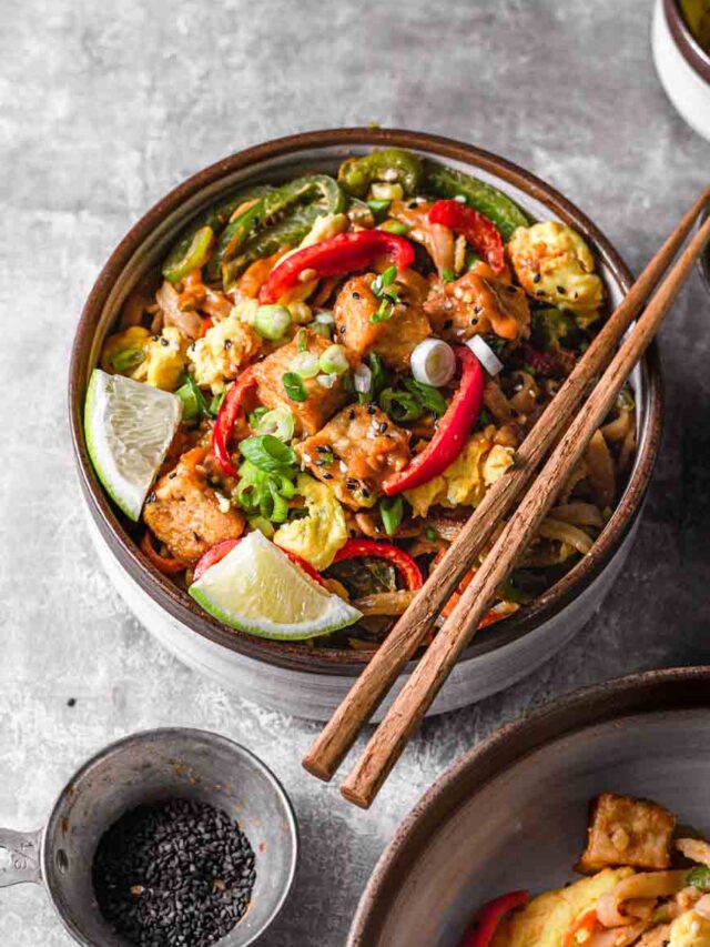 cold noodles tossed in peanut sauce with shredded carrots